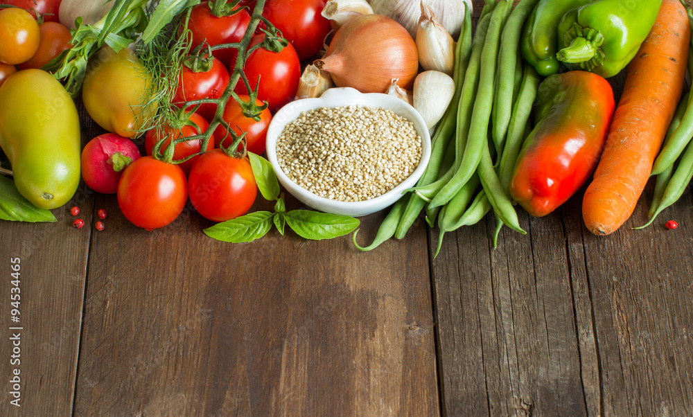 Quinoa in a bowl and fresh vegetables Quinoa in a bowl and fresh vegetables