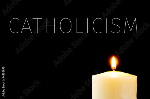 a lit candle and the word Catholicism