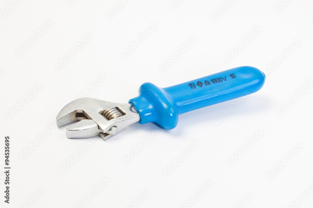 Close up new universal alligator spanner tool on white background Close up new universal alligator spanner tool on white background
