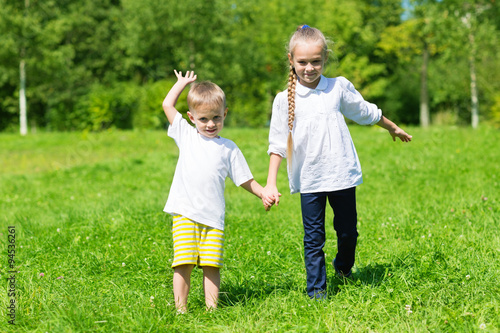 Brother and sister in park