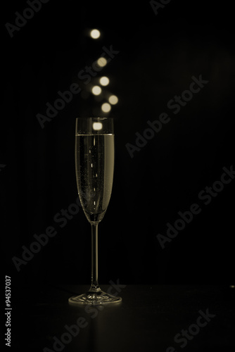 Glass of champagne with colored bubbles