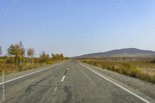 Mountain road on the Far Eastern taiga.  Mountain road on a ridge of the Sikhote - Alin , Far East Russia . © igor16buschin