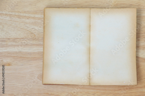 Stock Photo:.Open Book blank on old wood background © singkamc