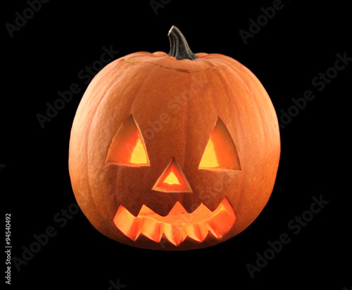 Halloween pumpkin with scary face isolated on black background. 