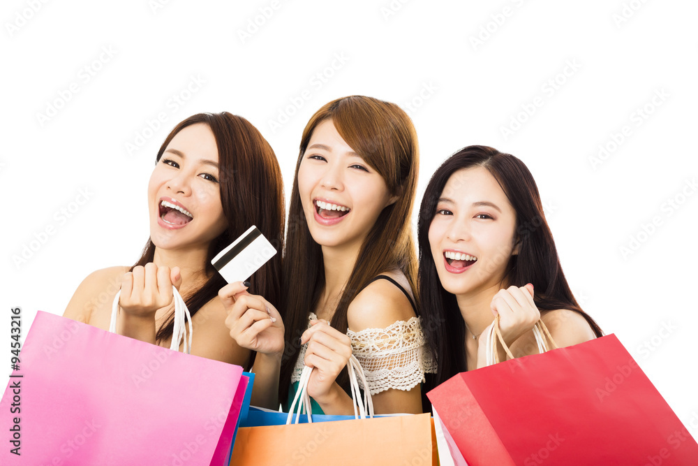 Group of happy young woman with shopping bags and credit card Group of happy young woman with shopping bags and credit card