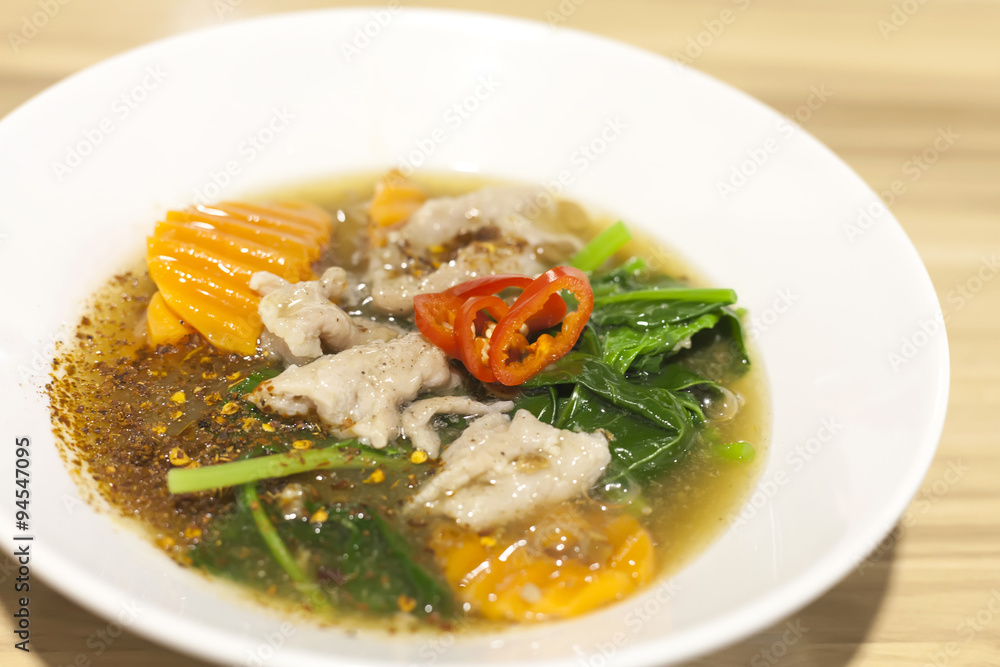 Fried noodle with pork and kale soaked in gravy soup Fried noodle with pork and kale soaked in gravy soup