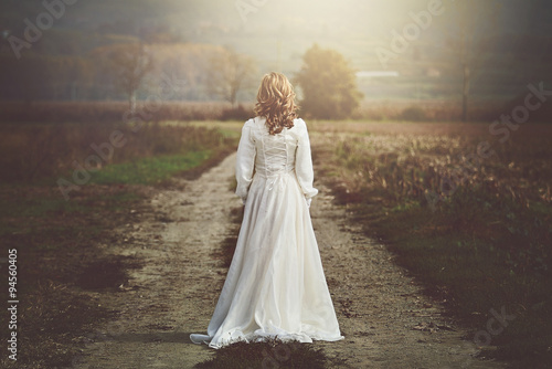 Bride with beautiful dress in country fields