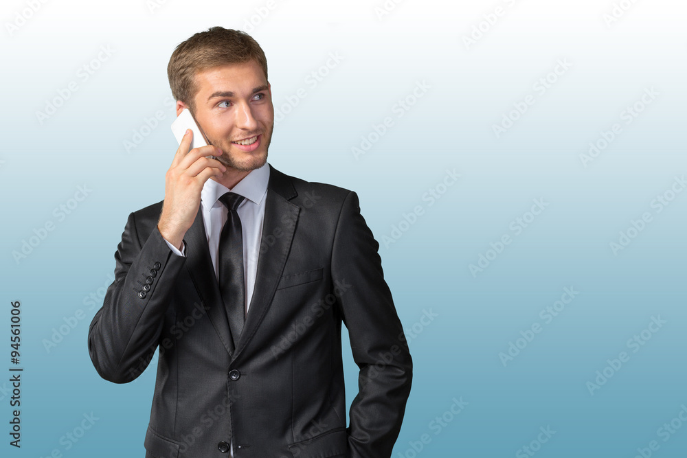 Young handsome businessman talking on mobile phone Young handsome businessman talking on mobile phone