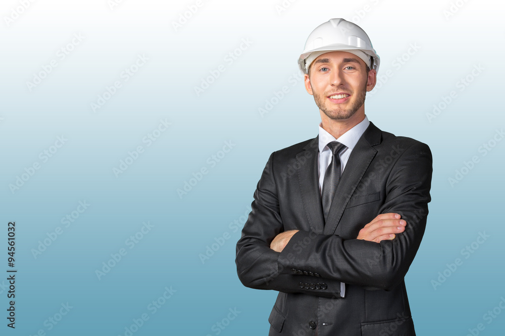 Young handsome engineer in white hardhat Young handsome engineer in white hardhat