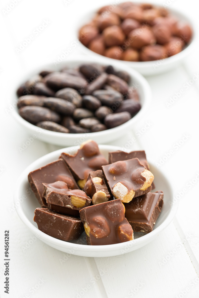 chocolate, hazelnuts and cocoa beans chocolate, hazelnuts and cocoa beans