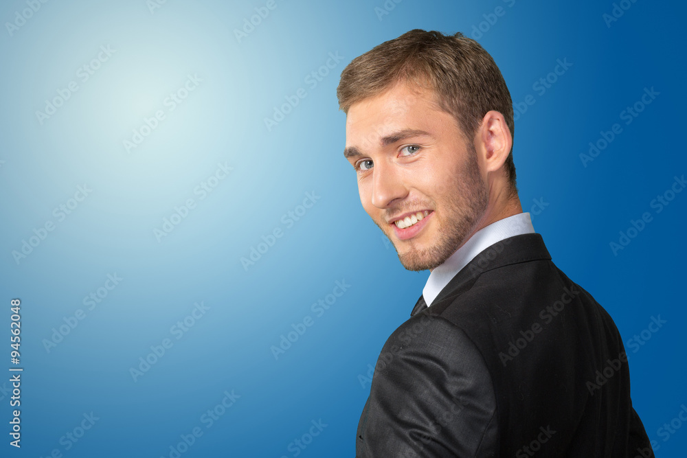 Young Businessman looking over his shoulder Young Businessman looking over his shoulder