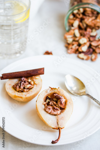spicy baked pear with walnuts, honey, cinnamon sticks, healthy d