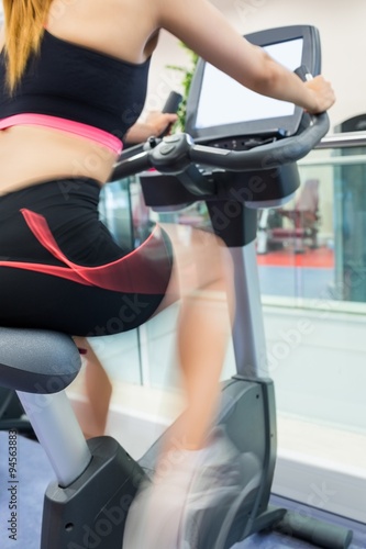 Woman exercising on an exercise bike