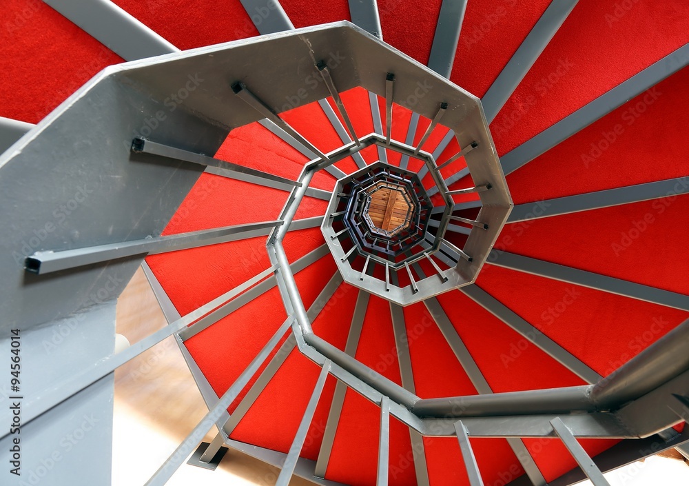 spiral staircase with red carpet in a modern building Stock Photo ...
