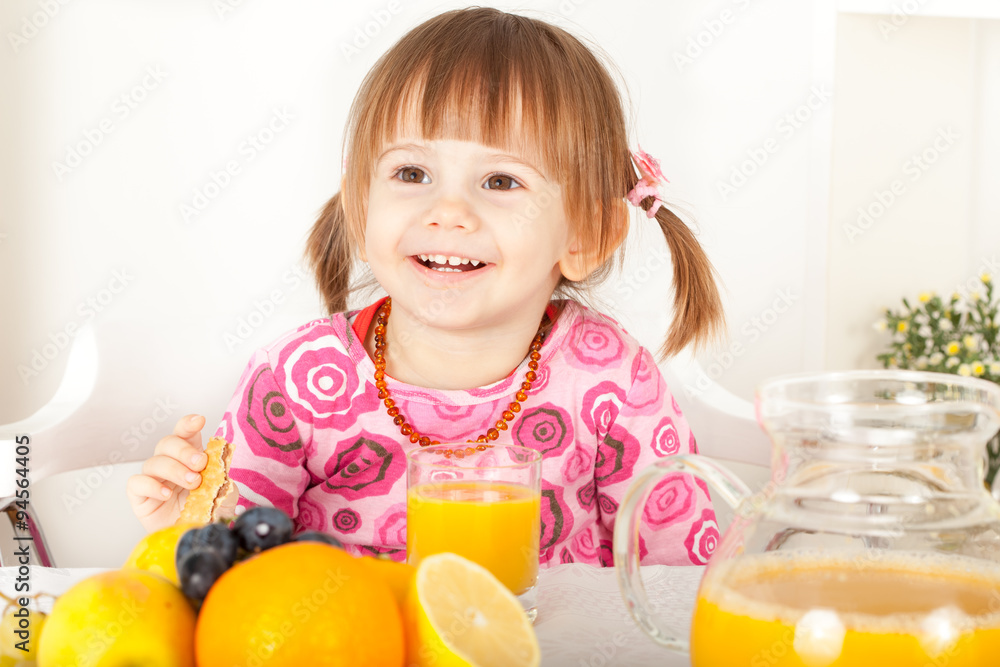 Smiling little girl with orange juice Smiling little girl with orange juice