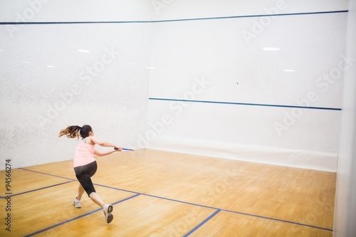 Woman playing a game of squash