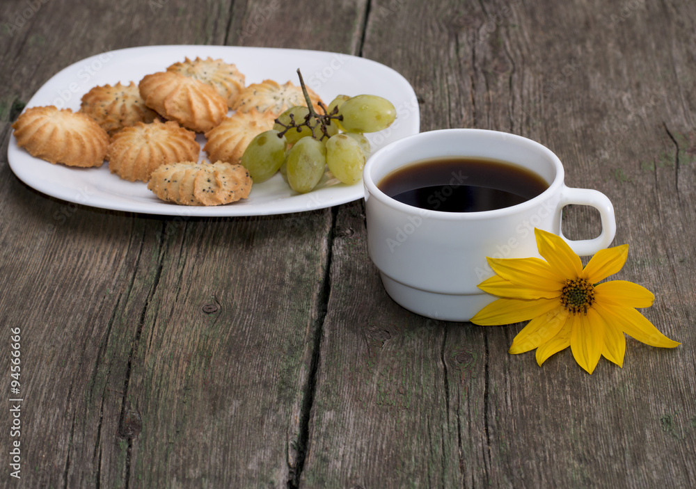 plate with cookies, a cup of coffee and a yellow flower, a still plate with cookies, a cup of coffee and a yellow flower, a still