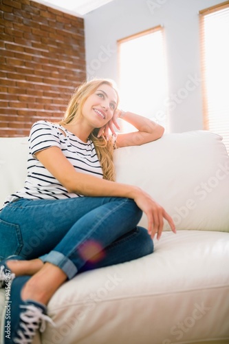 Pretty blonde relaxing on the couch
