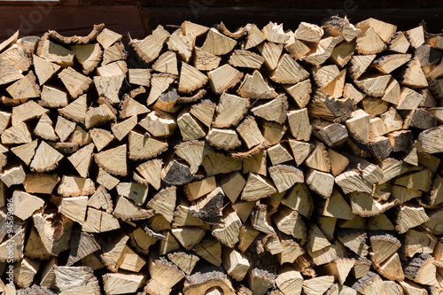 dry chopped firewood logs in a pile