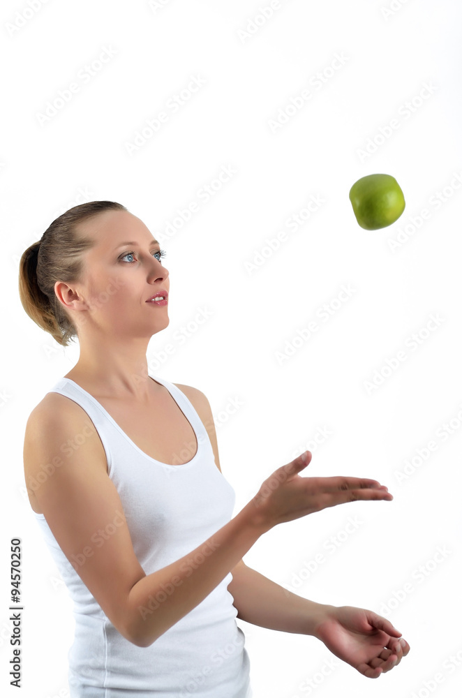 Beautiful blondy woman is playing with green apple Beautiful blondy woman is playing with green apple