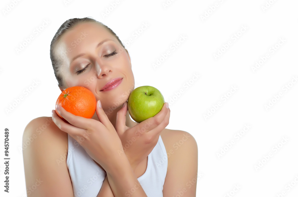 attractive athletic blondy woman with green apple and orange attractive athletic blondy woman with green apple and orange