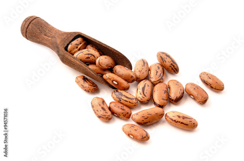 Pinto beans in a wooden scoop photo