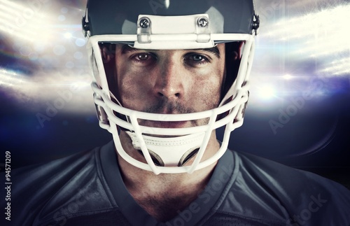 Composite image of american football player looking at camera © vectorfusionart