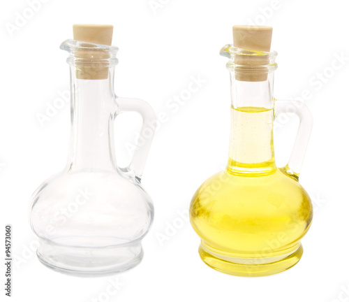 Oil in glass bottle and empty bottle