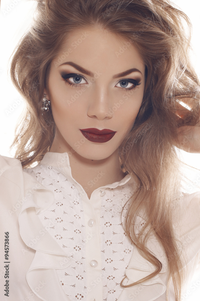 sexy lady with long blond curly hair, bright evening makeup sexy lady with long blond curly hair, bright evening makeup