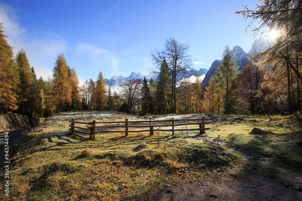Mountain pasture with morning frost on grass