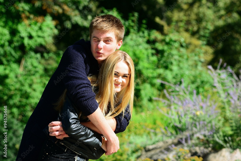 Young couple in Vilnius town Bernardinu garden on autumn