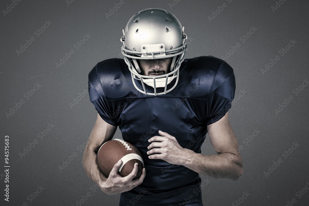 Composite image of sports player holding ball