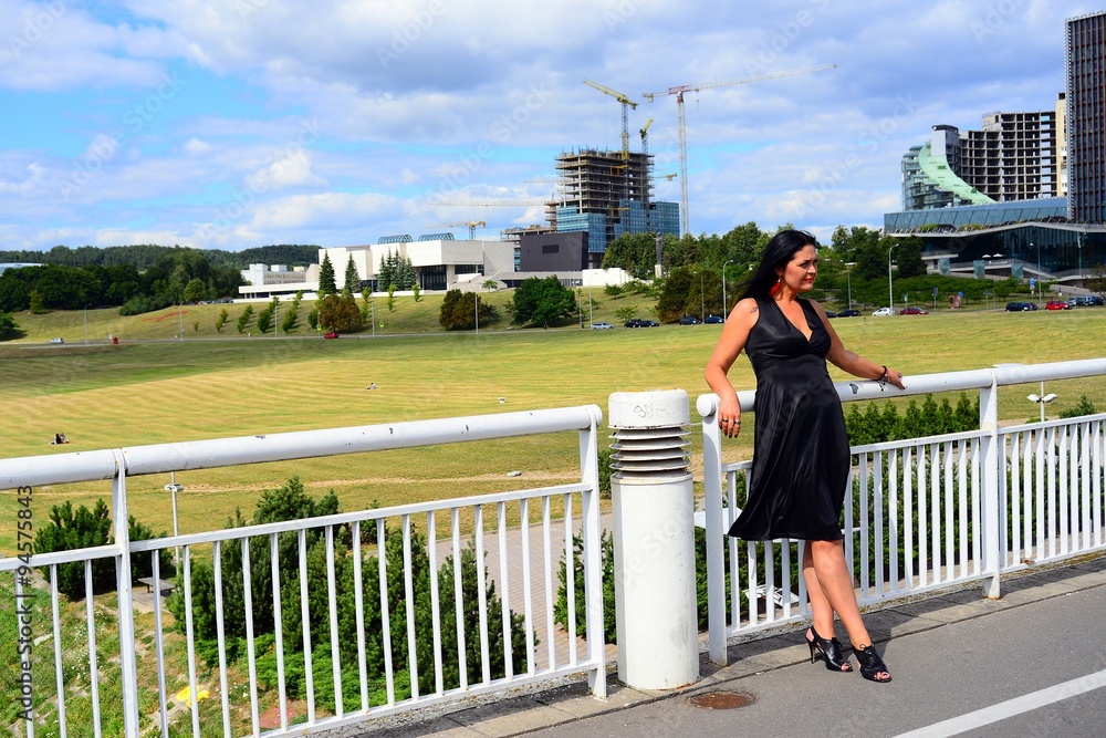 Woman in black on the bridge in Vilnius town