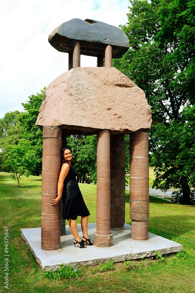 Woman in black and rocks in the Vilnius city