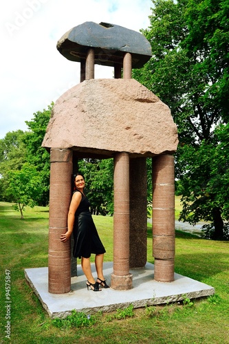 Obraz na płótnie Woman in black and rocks in the Vilnius city w salonie