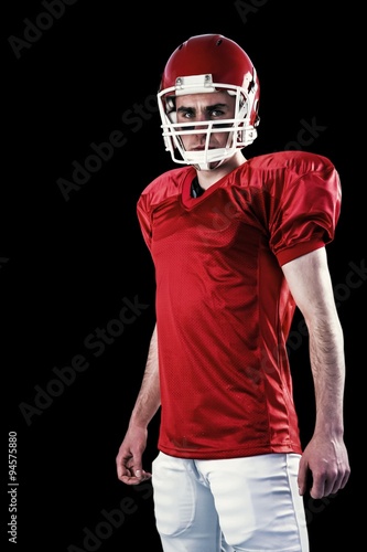 Composite image of a serious american football player