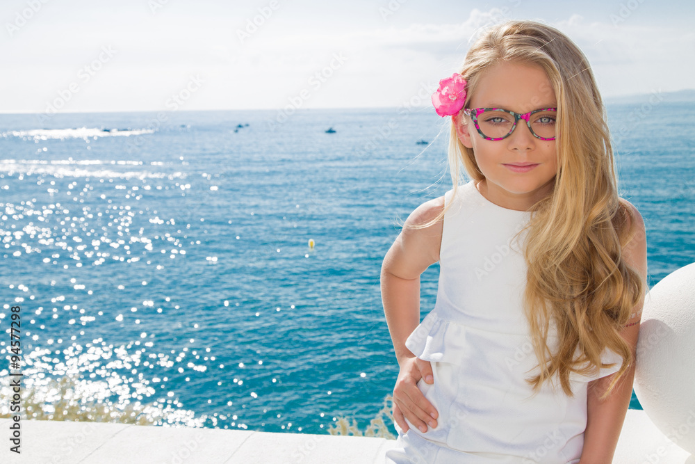 Young beautiful girl model long curly blond hair smiling in pink ...