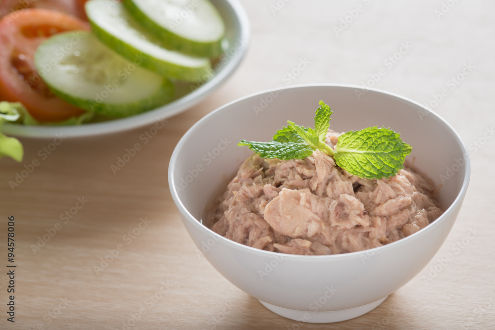 Canned tuna with vegetable on wooden background. Canned tuna with vegetable on wooden background.
