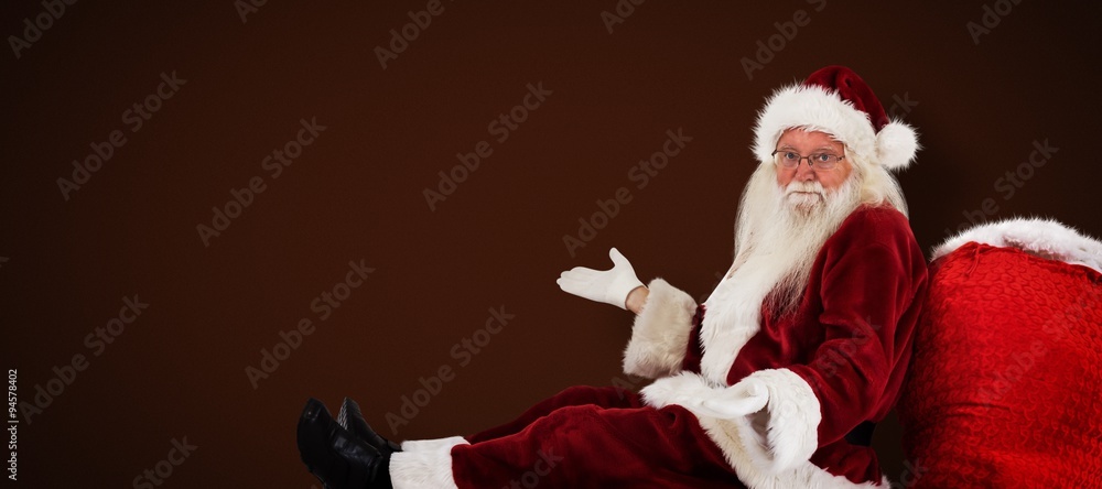 Composite image of santa sits leaned on his bag and has no clue Composite image of santa sits leaned on his bag and has no clue