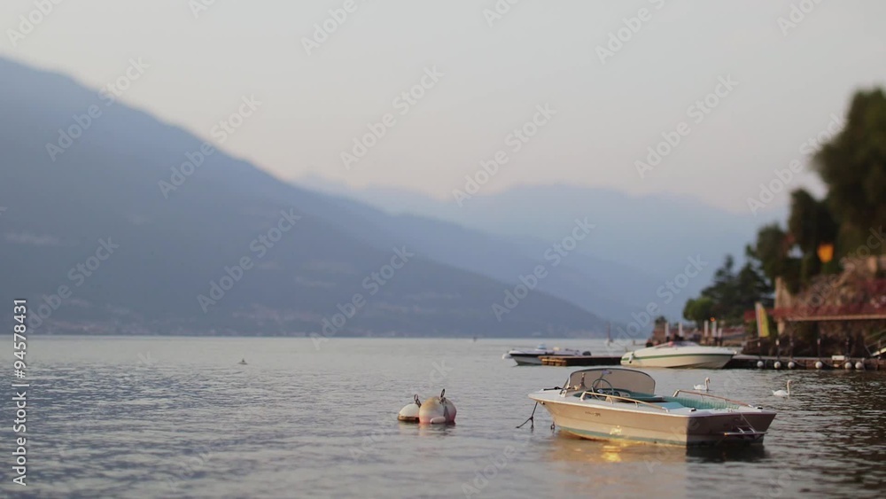 The beautiful shores of Lake Como and the Italian Alps in background. Sunset The beautiful shores of Lake Como and the Italian Alps in background. Sunset