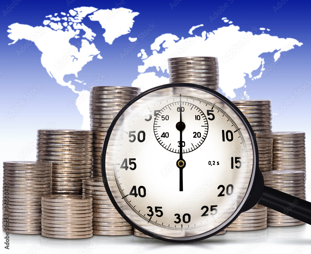 Coins and magnifier Stock Photo | Adobe Stock