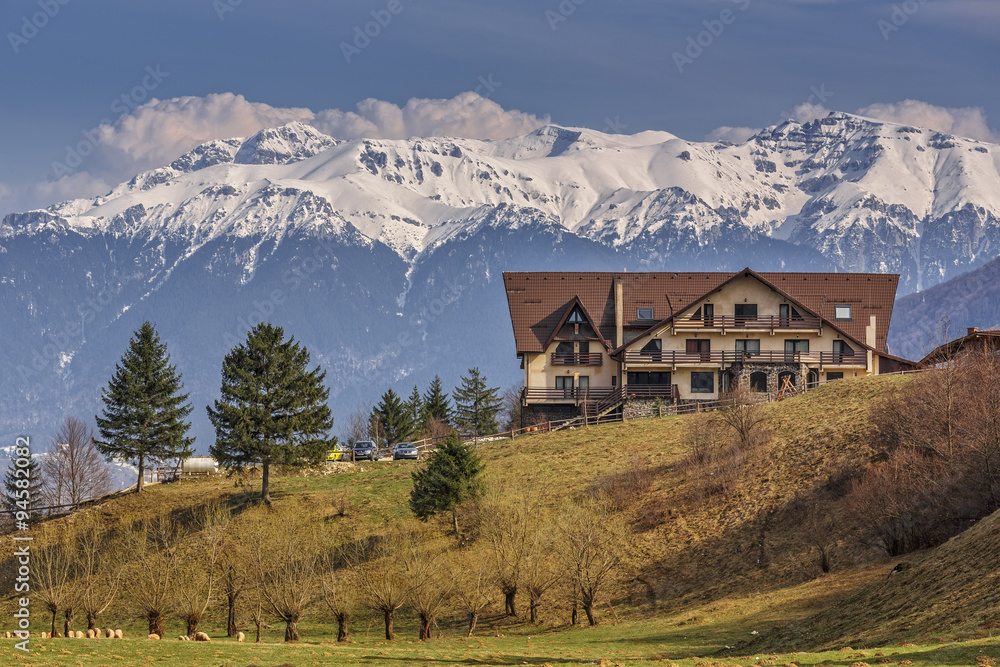 Picturesque Bucegi mountains landscape with chalet, Romania