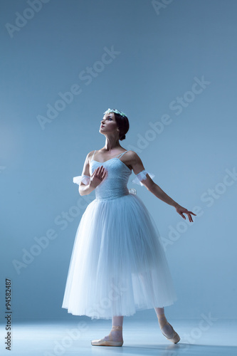 Portrait of the ballerina on blue background