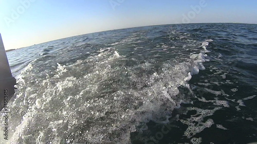 Wallpaper Mural Low angle view from the stern of a dinghy with wake from outboard motor. Torontodigital.ca