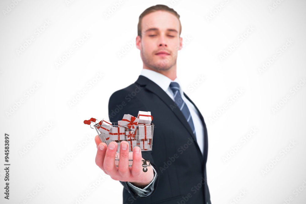 Composite image of serious businessman holding out his hand Composite image of serious businessman holding out his hand