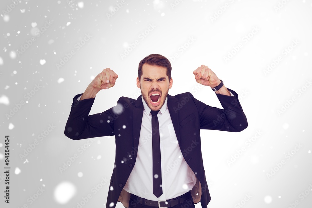 Composite image of furious businessman tensing arms muscle Composite image of furious businessman tensing arms muscle