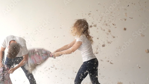 Pretty couple fighting pillows 