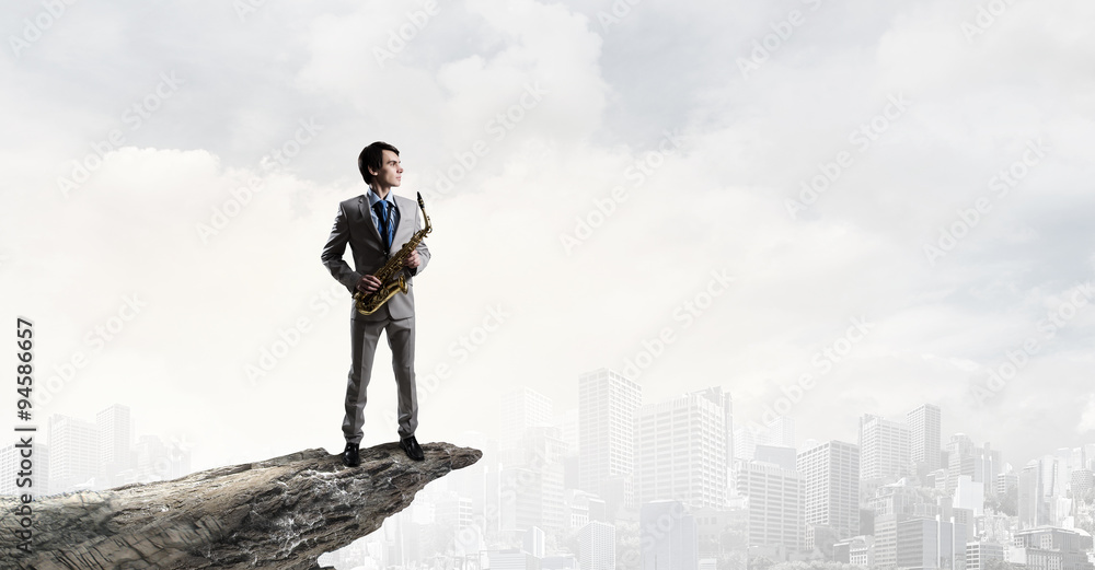 Handsome saxophonist. Concept image Handsome saxophonist. Concept image