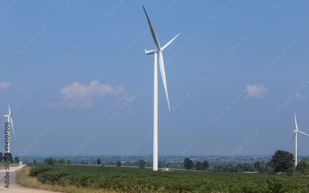 wind turbines generating electricity power from natural on cassava plantation