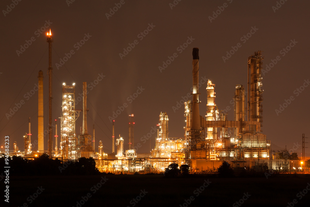 Fototapeta premium Oil refinery, petrochemical plant at industial estate night time